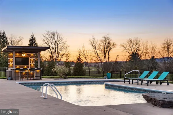 a backyard of a house with outdoor seating