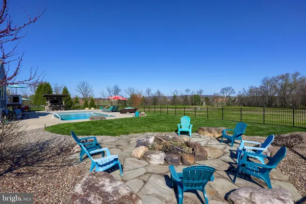 a view of a house with backyard porch and sitting area