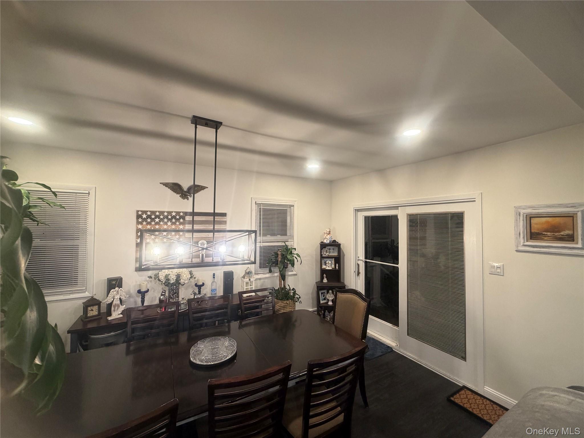 1580 North Jerusalem Road Merrick, NY 11566 - Photo 18 of 36 The property features dark flooring, white walls, and recessed lighting