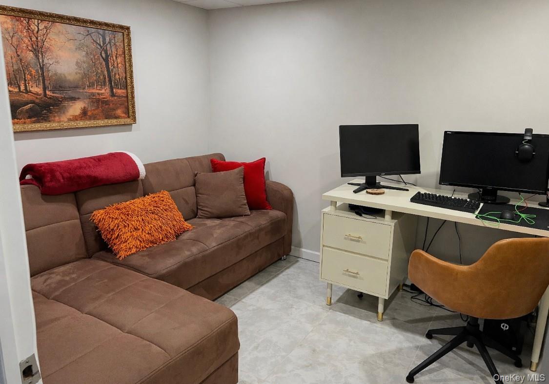 1580 North Jerusalem Road Merrick, NY 11566 - Photo 29 of 36 This versatile room features light-colored walls and flooring, providing a neutral canvas