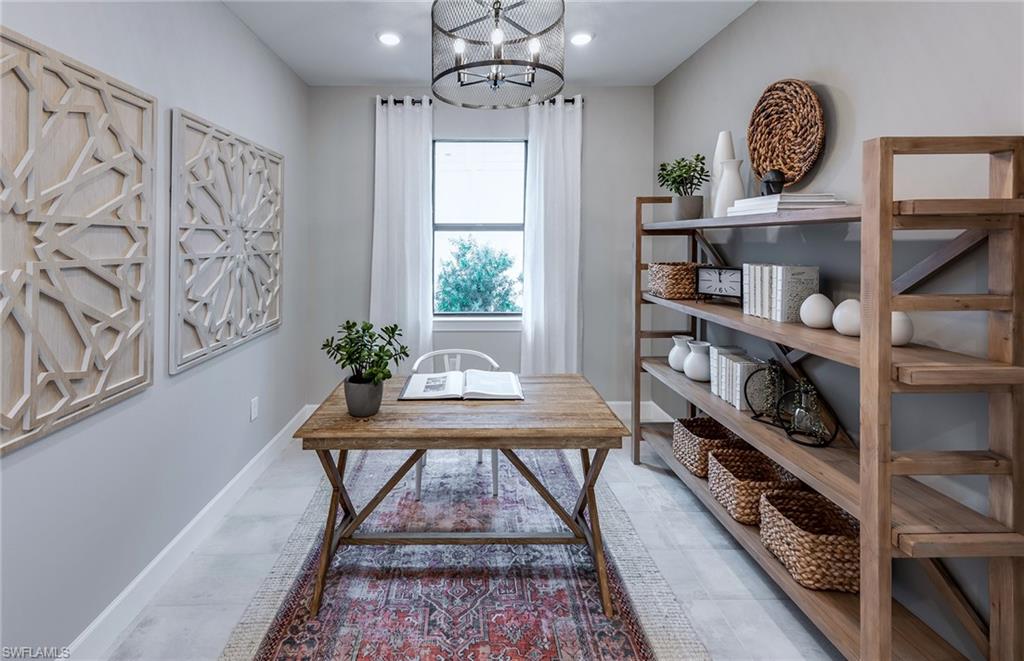 15665 Northridge Road Punta Gorda, FL 33982 - Photo 16 of 49 a view of a room with shelves and wooden floor