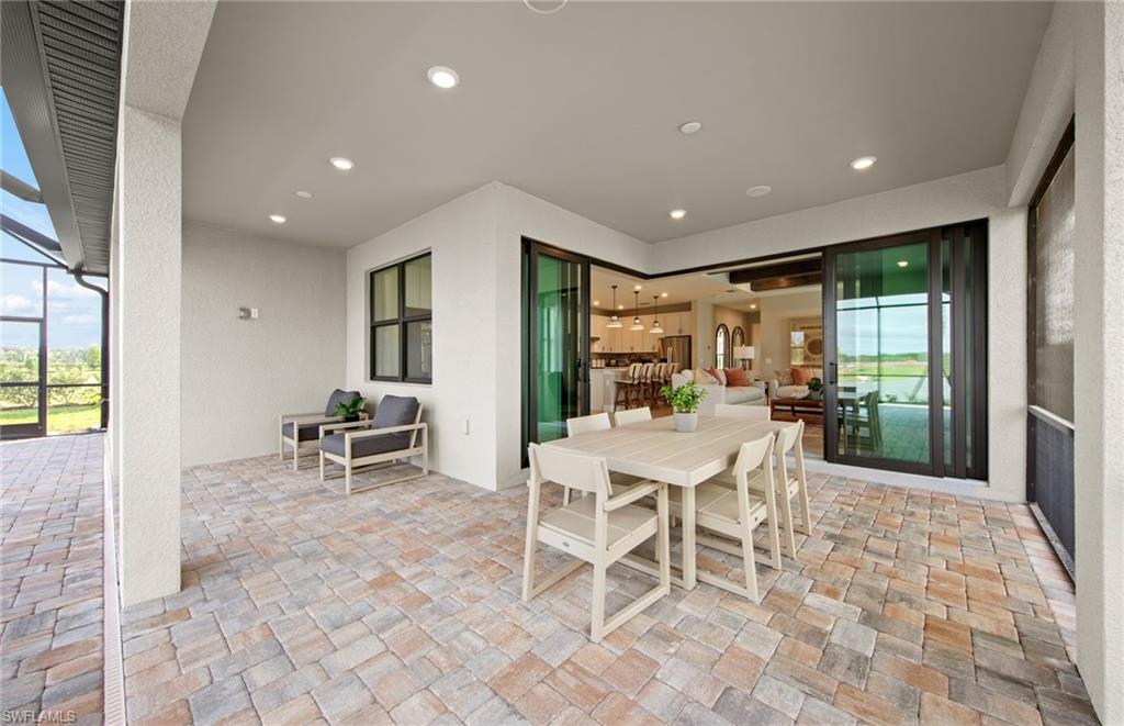 15665 Northridge Road Punta Gorda, FL 33982 - Photo 19 of 49 a dining hall with stainless steel appliances a dining table and chairs