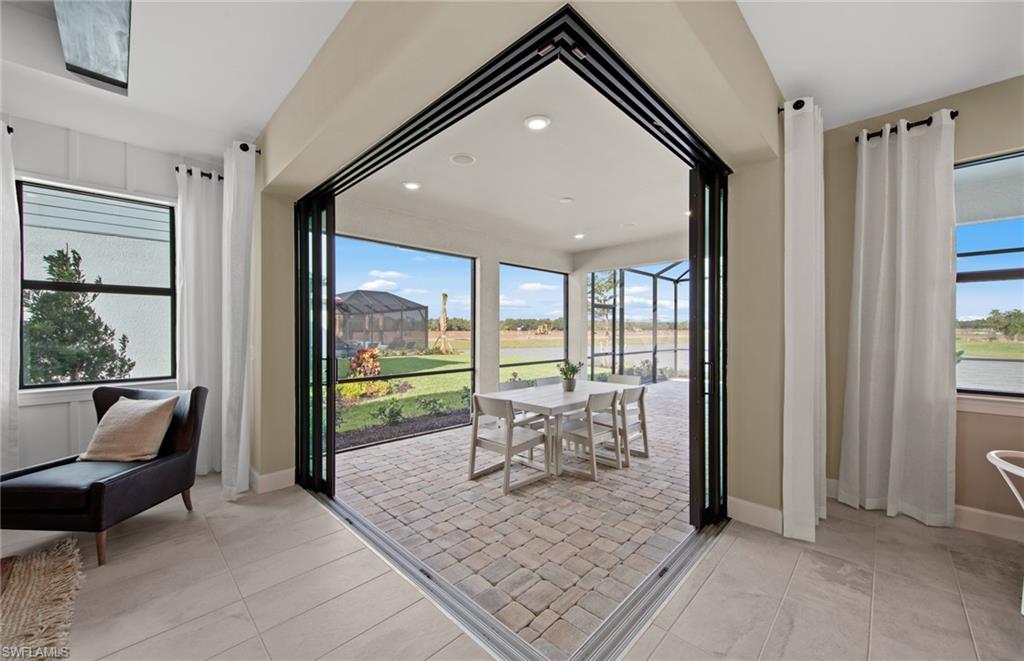 15665 Northridge Road Punta Gorda, FL 33982 - Photo 9 of 49 a living room with furniture and large windows