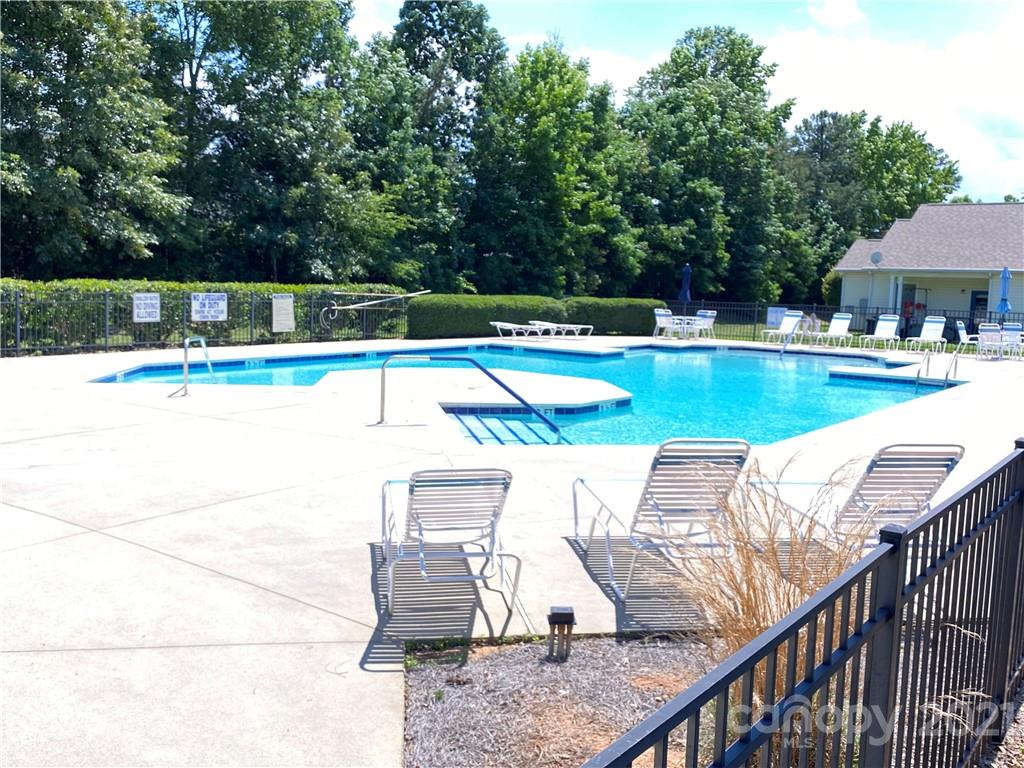 808 Stone Village Drive Fort Mill, SC 29708 - Photo 3 of 3 a view of a swimming pool with a patio and a yard