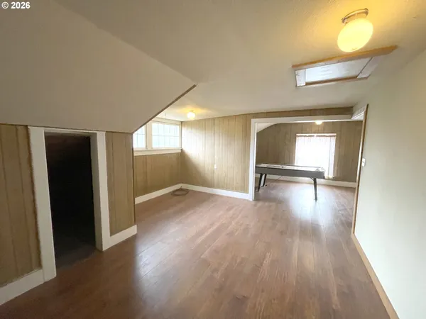 a view of a hallway with furniture