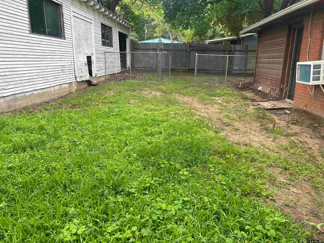 a backyard of a house with lots of green space
