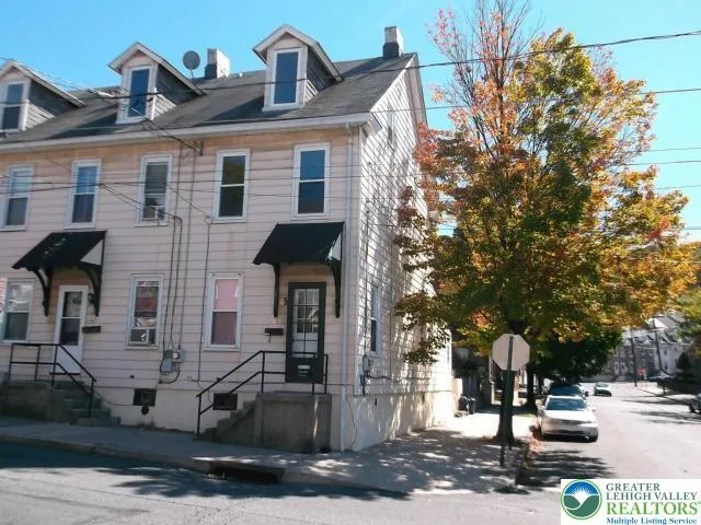 a front view of a building with street view