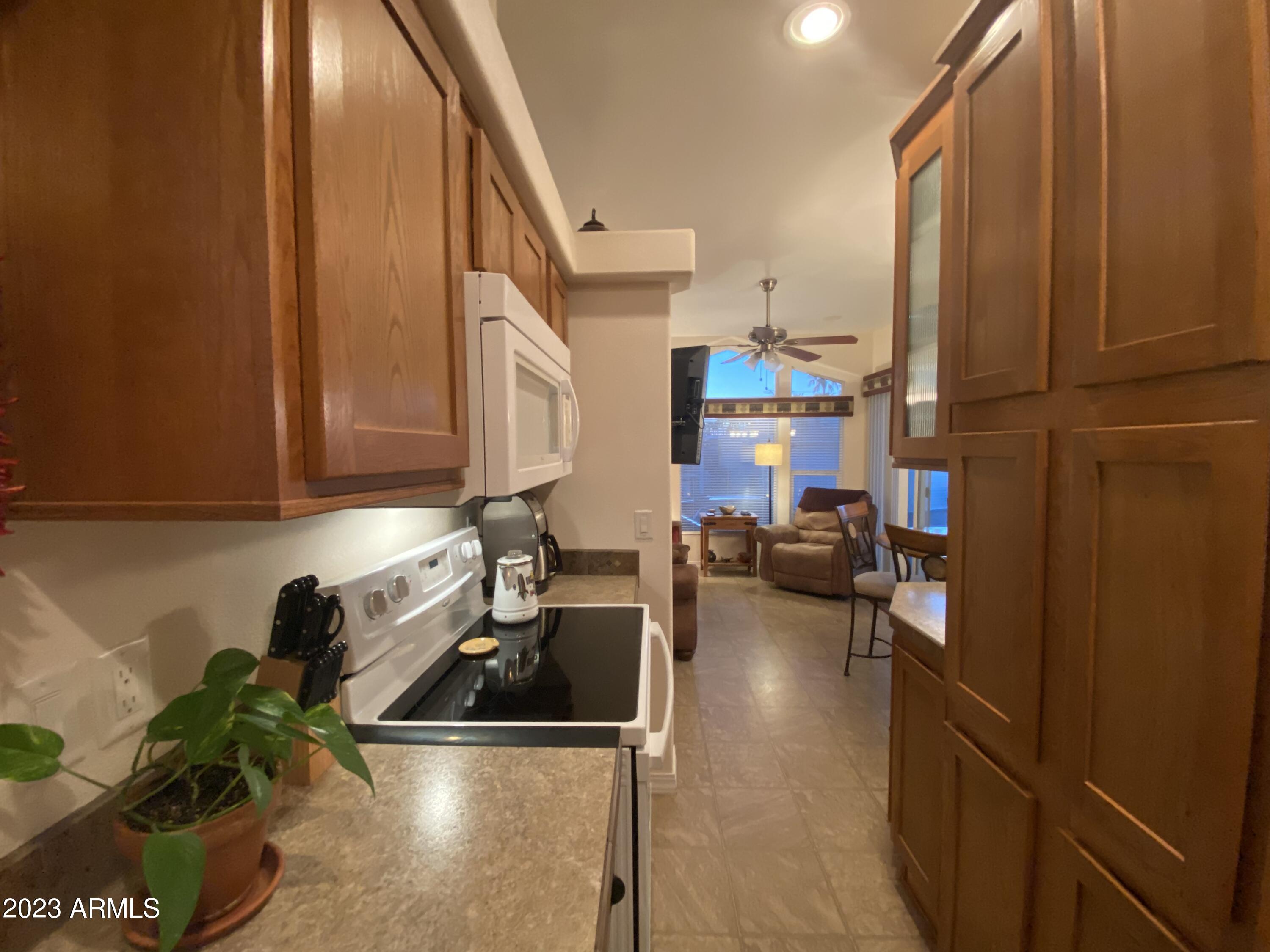 1358 Kiowa Circle, Unit 358 Apache Junction, AZ 85119 - Photo 11 of 37 a view of living room with furniture and a window
