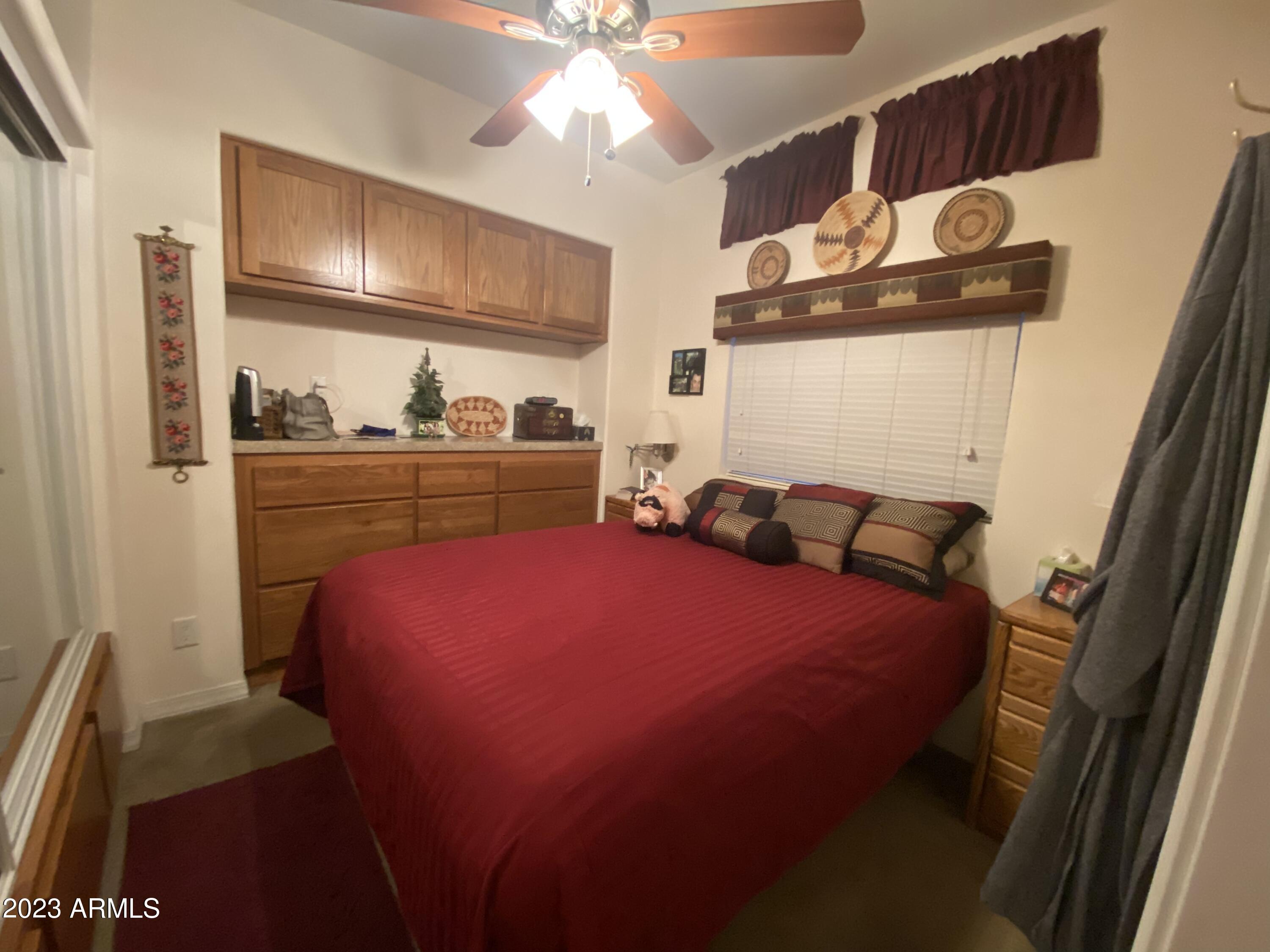 1358 Kiowa Circle, Unit 358 Apache Junction, AZ 85119 - Photo 12 of 37 a bed room with a bed