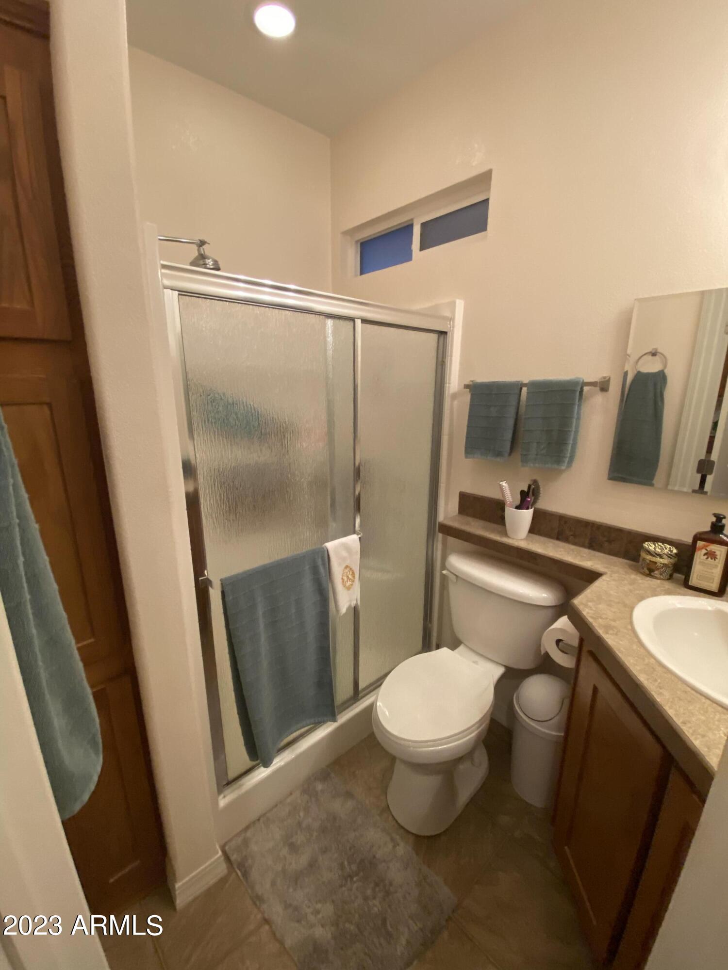 1358 Kiowa Circle, Unit 358 Apache Junction, AZ 85119 - Photo 16 of 37 a bathroom with a toilet and a shower