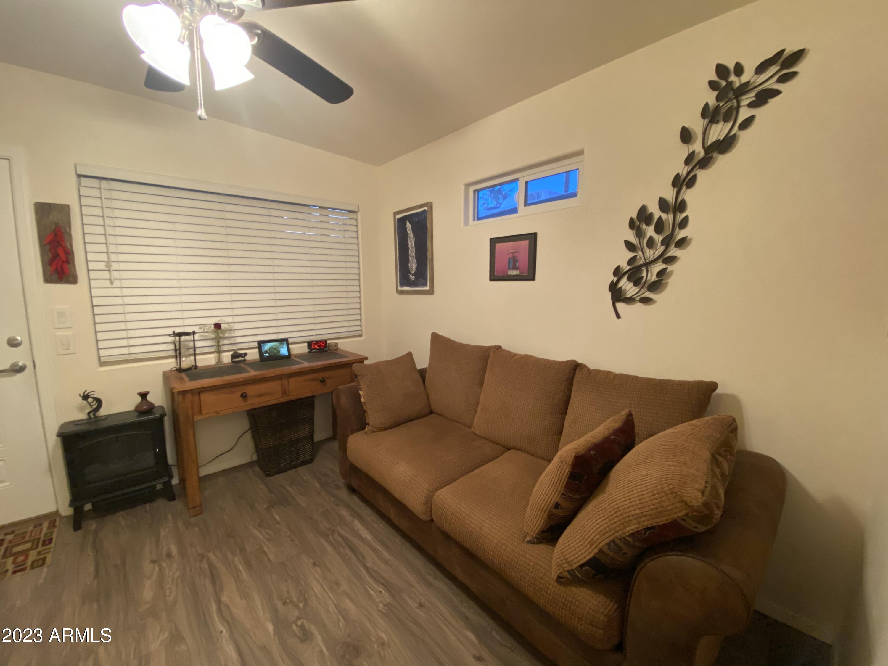 1358 Kiowa Circle, Unit 358 Apache Junction, AZ 85119 - Photo 19 of 37 a living room with furniture and a window