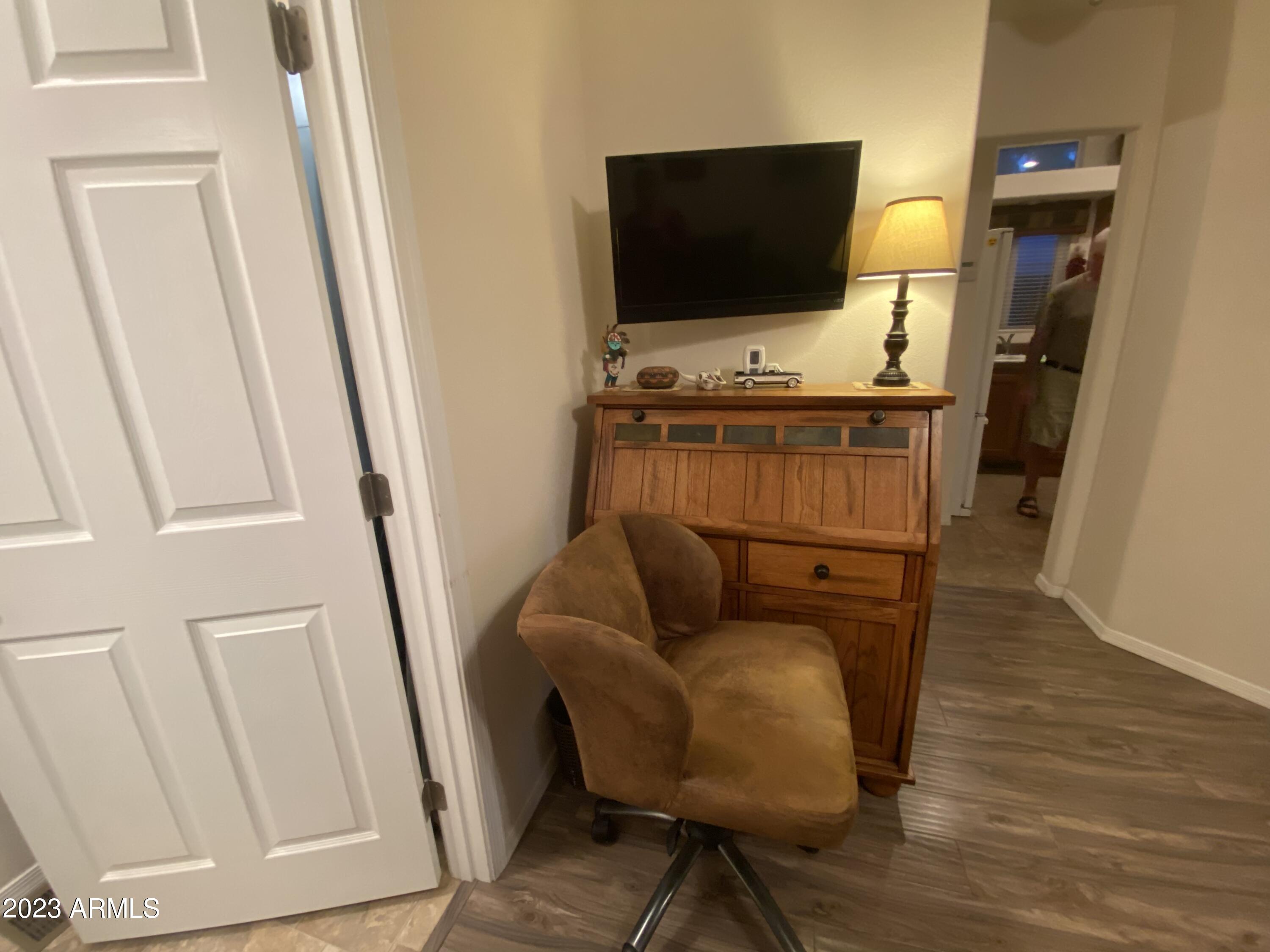 1358 Kiowa Circle, Unit 358 Apache Junction, AZ 85119 - Photo 21 of 37 a living room with furniture and a flat screen tv