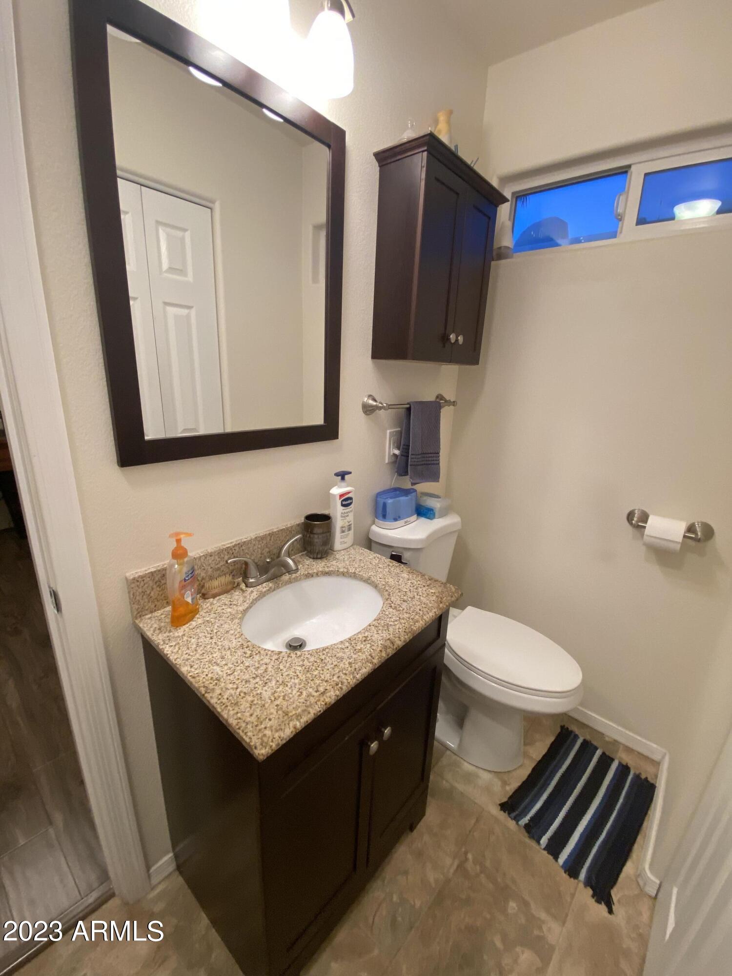 1358 Kiowa Circle, Unit 358 Apache Junction, AZ 85119 - Photo 22 of 37 a bathroom with a sink and a toilet