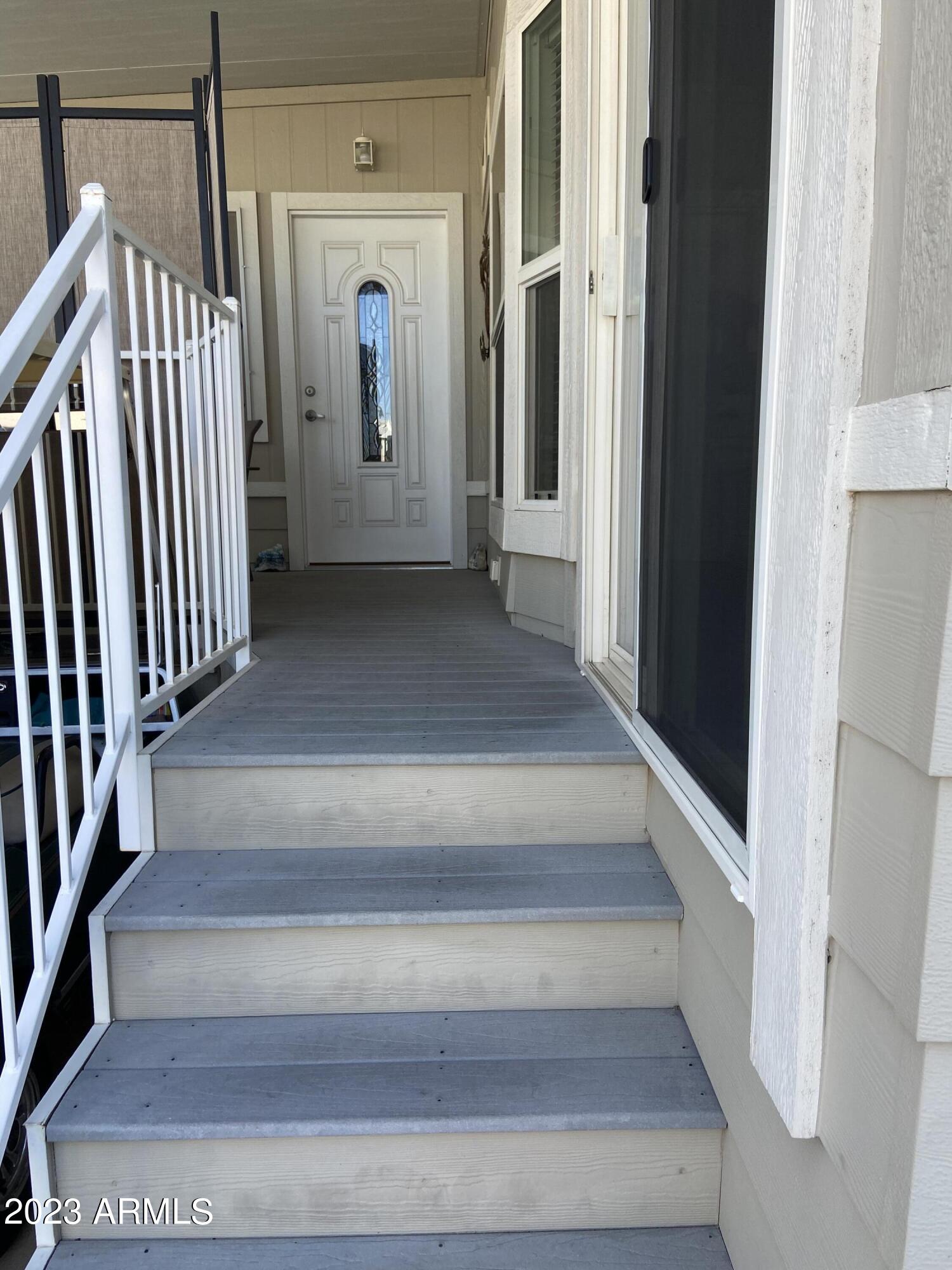 1358 Kiowa Circle, Unit 358 Apache Junction, AZ 85119 - Photo 28 of 37 a view of staircase with lots of frames and stairs
