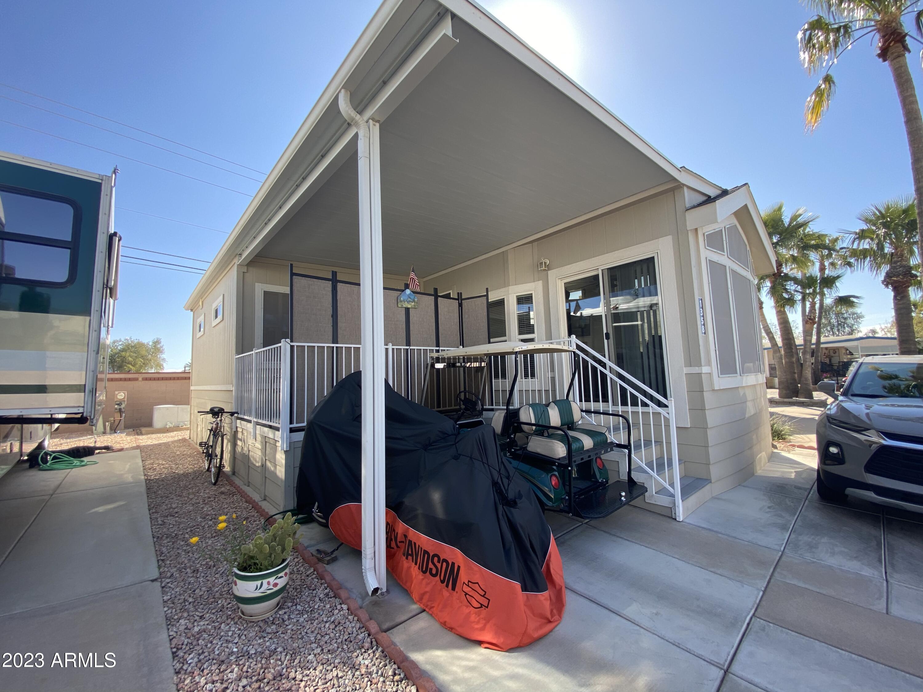 1358 Kiowa Circle, Unit 358 Apache Junction, AZ 85119 - Photo 33 of 37 a view of a house with backyard and sitting area