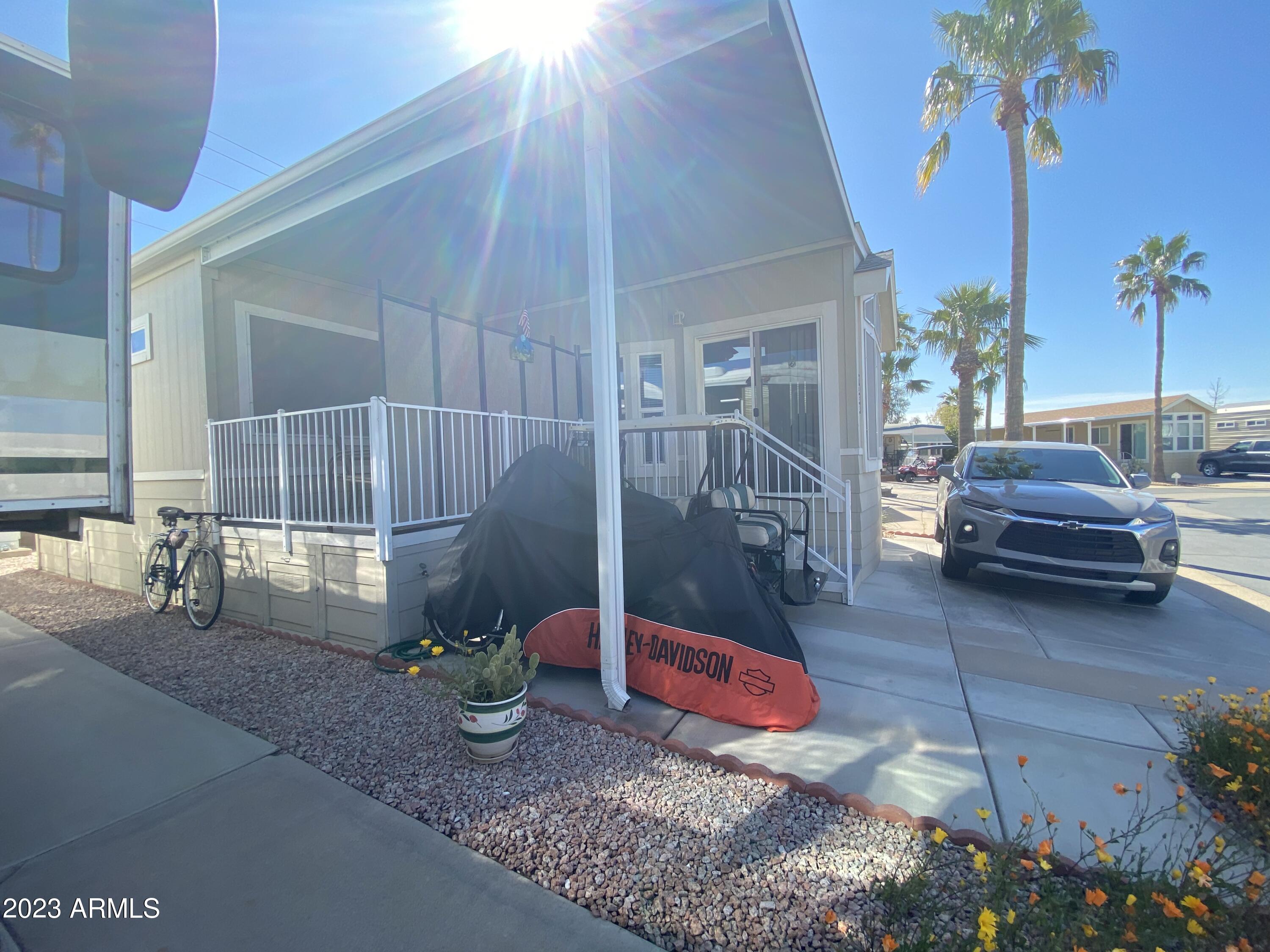 1358 Kiowa Circle, Unit 358 Apache Junction, AZ 85119 - Photo 34 of 37 a view of yard from deck with patio