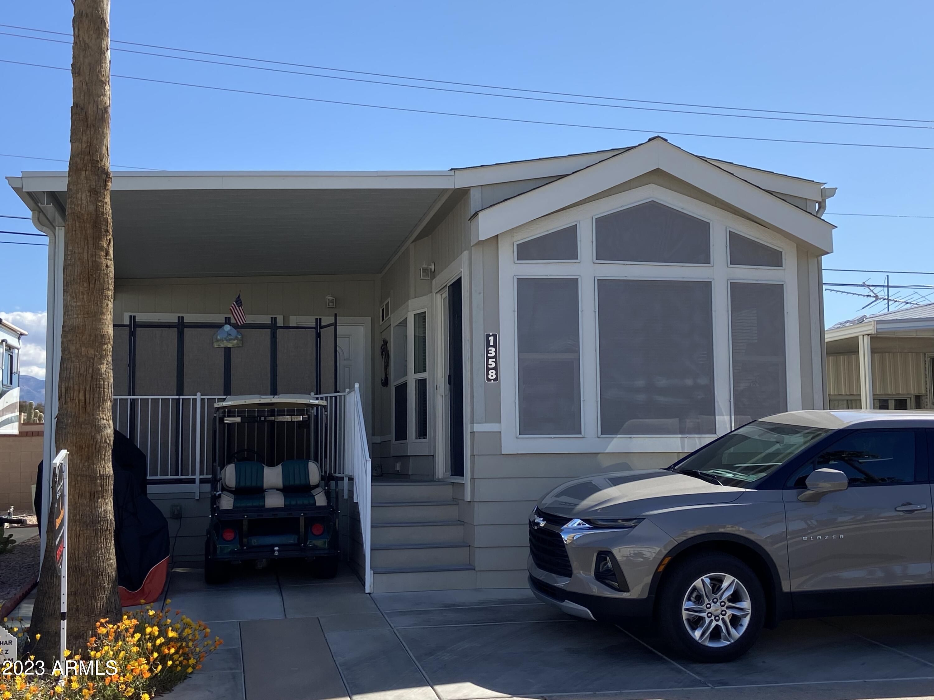 1358 Kiowa Circle, Unit 358 Apache Junction, AZ 85119 - Photo 36 of 37 a car parked in front of house