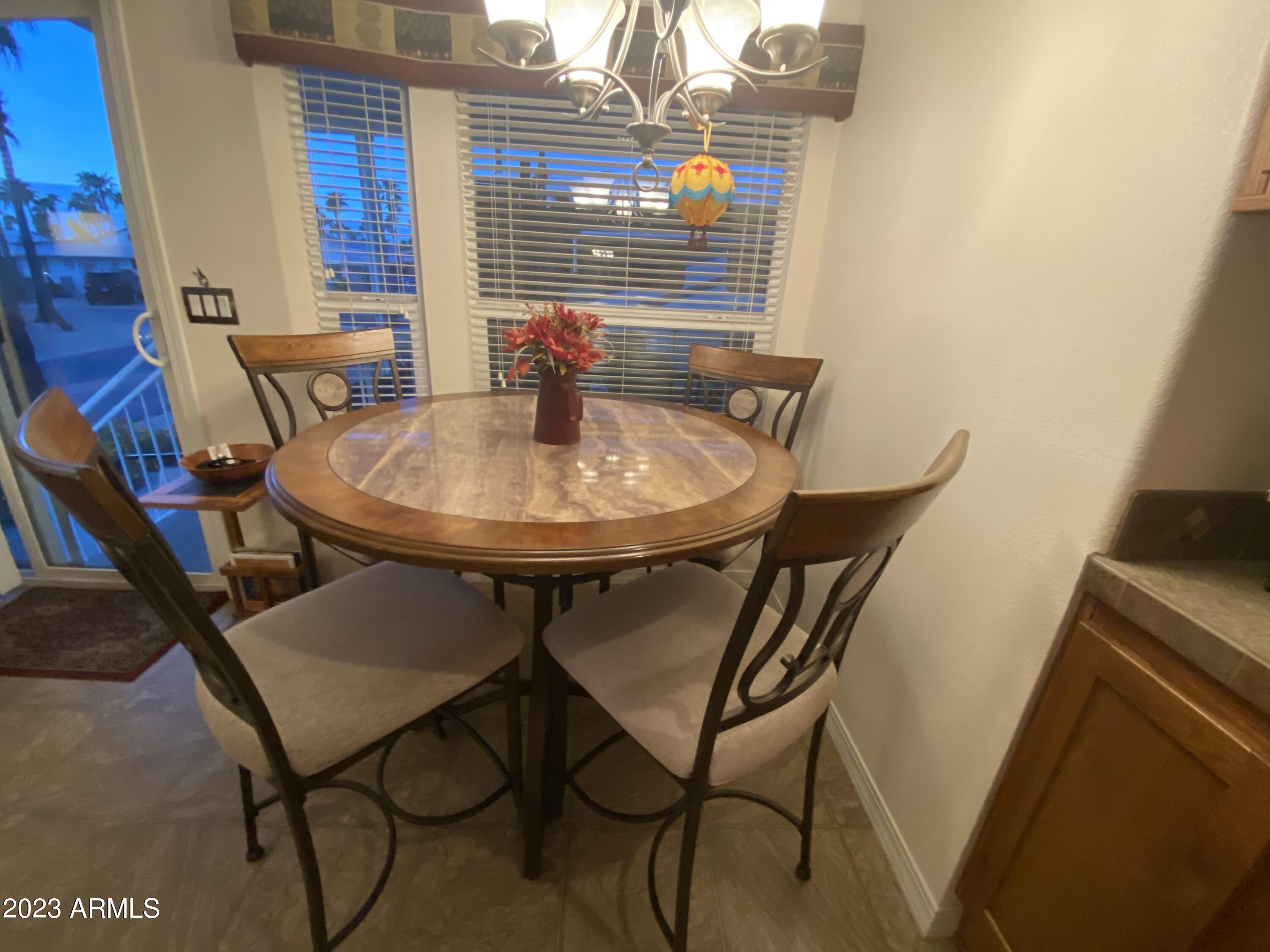 1358 Kiowa Circle, Unit 358 Apache Junction, AZ 85119 - Photo 5 of 37 a view of a room with table and chairs
