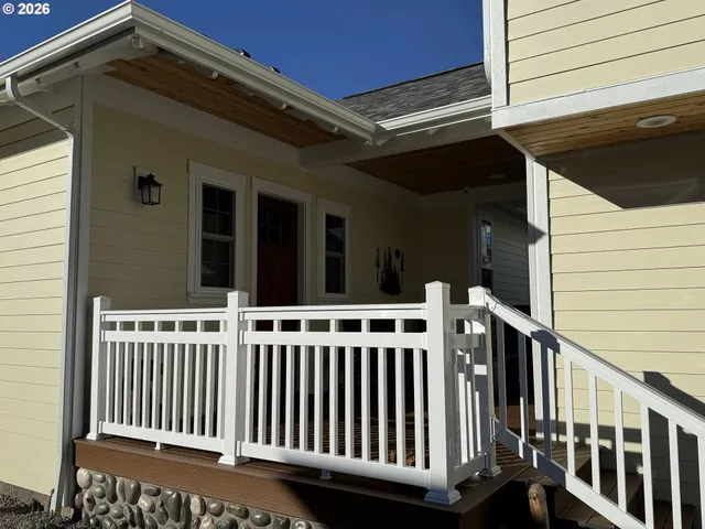 a view of a porch with wooden floor