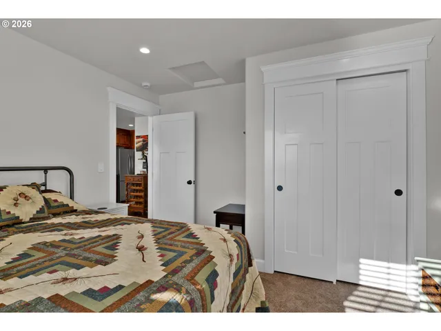 a bedroom with a bed and a cabinets