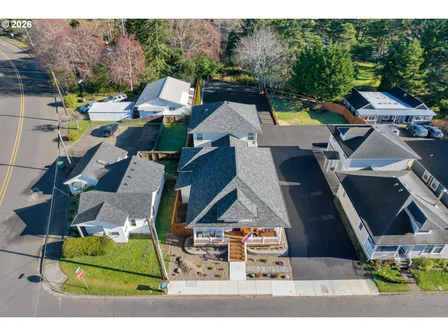 an aerial view of houses with yard