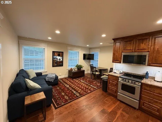 a living room with furniture fireplace and flat screen tv