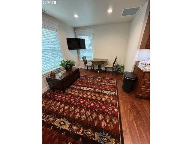a living room with furniture and a rug
