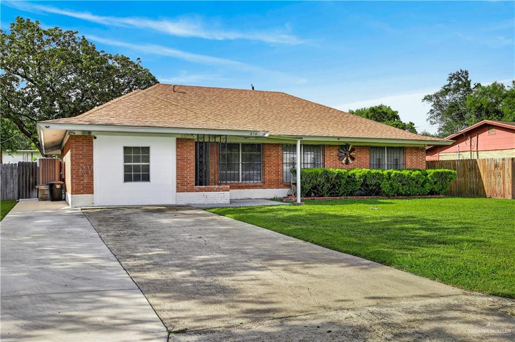 616 5th Street Weslaco, TX 78596 - Photo 18 of 33 a front view of a house with a yard