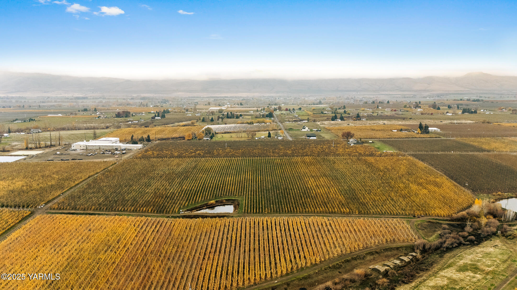Nka Occidental Road Yakima, WA 98908 - Photo 6 of 9 an aerial view of residential houses with outdoor space