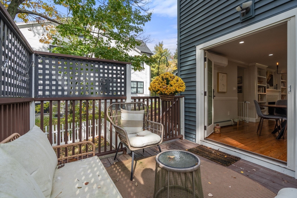 317 Dedham Avenue Needham, MA 02492 - Photo 13 of 29 a balcony with table and chairs