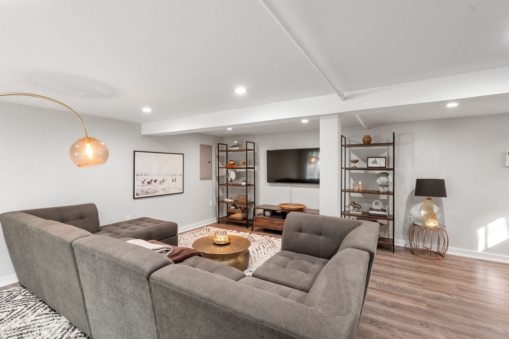 317 Dedham Avenue Needham, MA 02492 - Photo 19 of 29 a living room with furniture and a flat screen tv