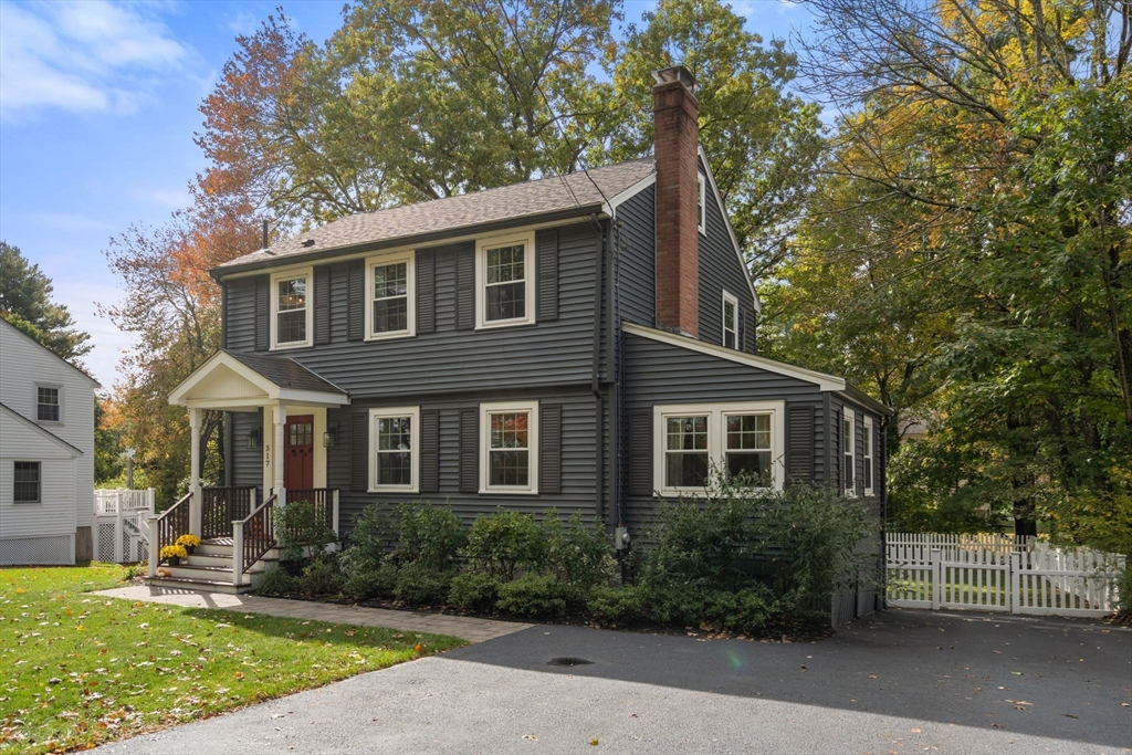 317 Dedham Avenue Needham, MA 02492 - Photo 2 of 29 a front view of a house with a yard