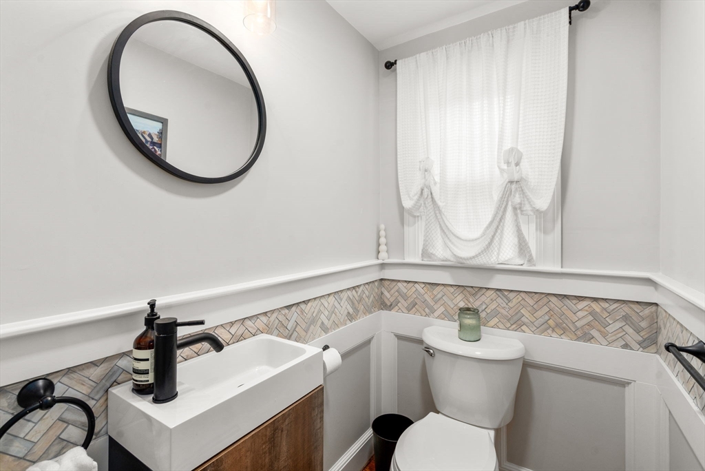 317 Dedham Avenue Needham, MA 02492 - Photo 23 of 29 a bathroom with a sink and a mirror