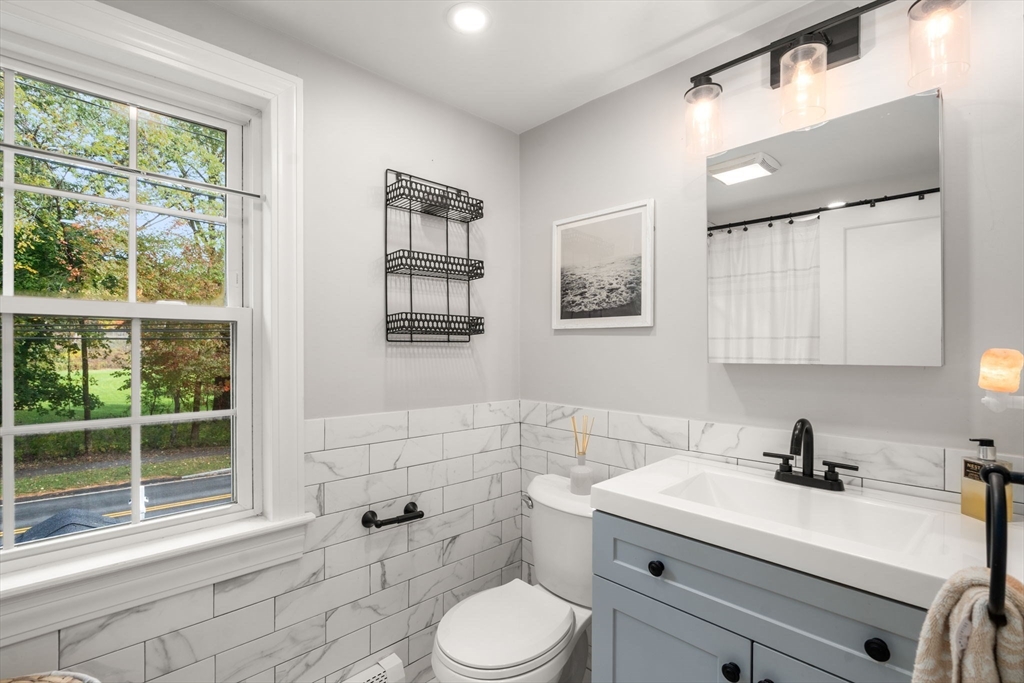 317 Dedham Avenue Needham, MA 02492 - Photo 24 of 29 a bathroom with a sink a toilet and shower