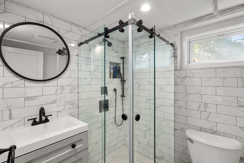 317 Dedham Avenue Needham, MA 02492 - Photo 25 of 29 a bathroom with a sink toilet and shower