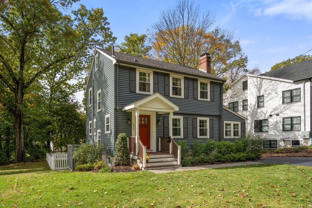 317 Dedham Avenue Needham, MA 02492 - Photo 3 of 29 a front view of a house with a yard