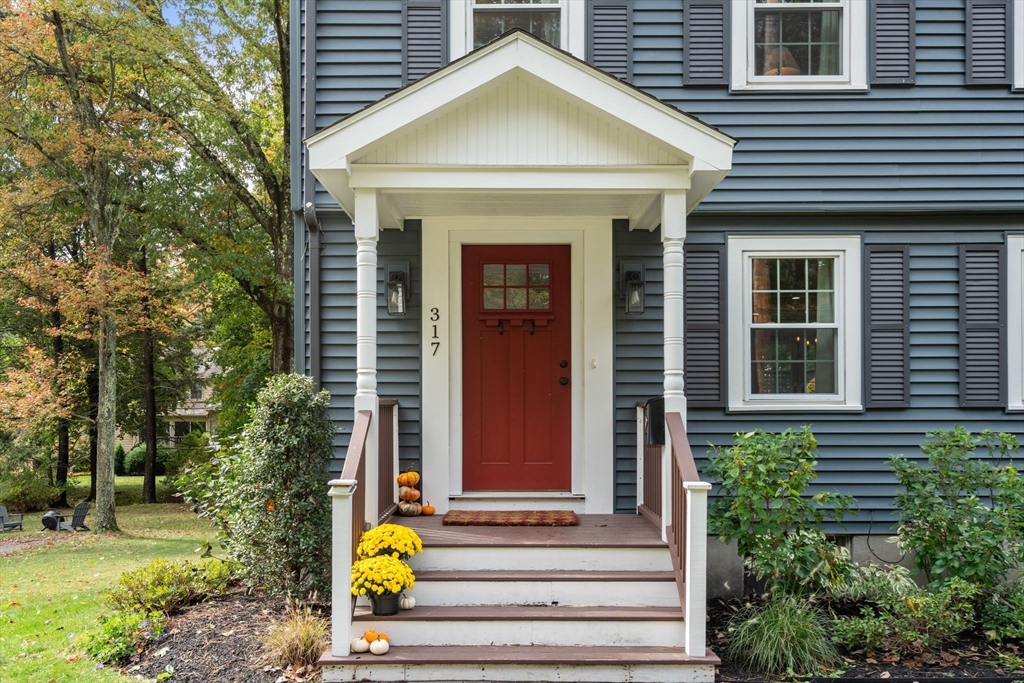 317 Dedham Avenue Needham, MA 02492 - Photo 4 of 29 a front view of a house with a garden