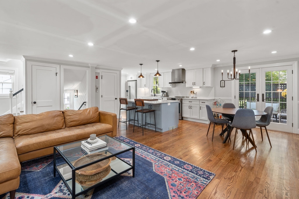 317 Dedham Avenue Needham, MA 02492 - Photo 6 of 29 a living room with furniture and a dining table with wooden floor