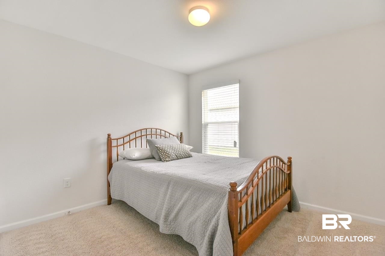17430 Harding Drive Foley, AL 36535 - Photo 23 of 37 Bedroom featuring baseboards and light colored carpet
