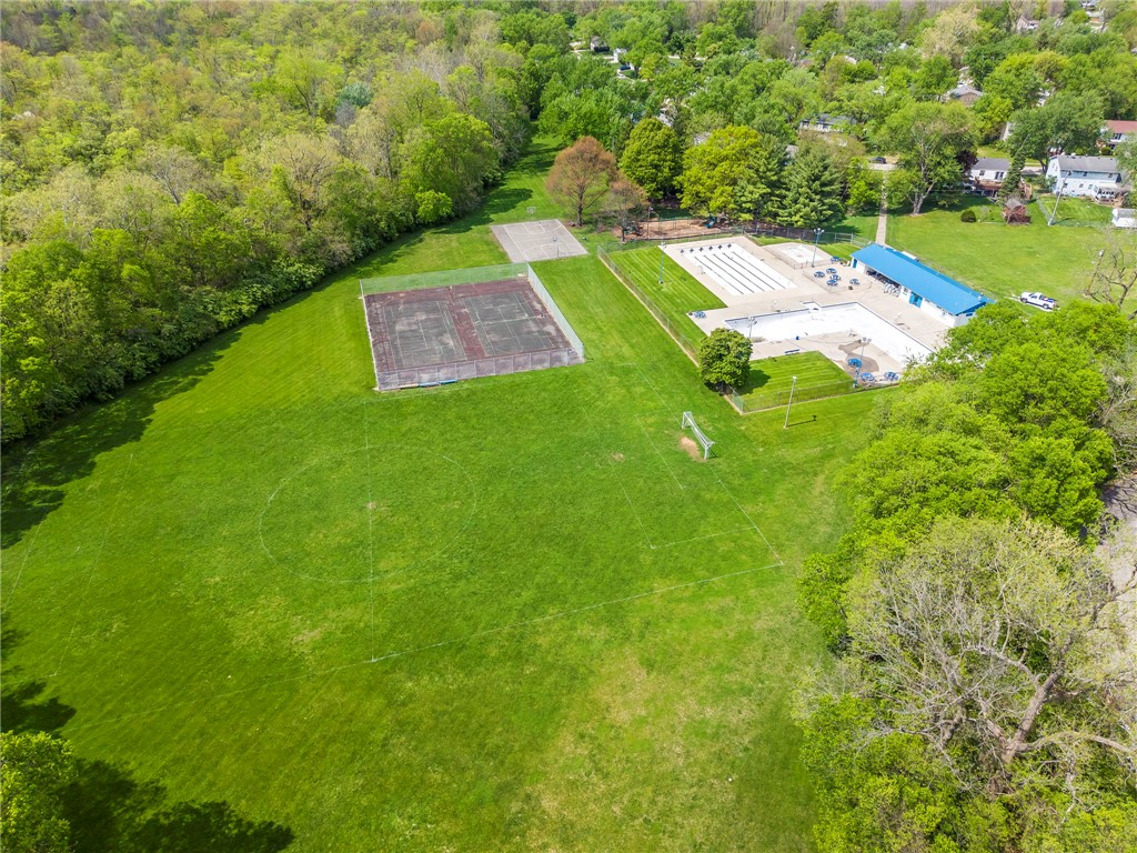 4919 Silver Arrow Drive Riverside, OH 45424 - Photo 56 of 57 An aerial view captures the vibrant outdoor recreational space, complete with a pool and sports courts.