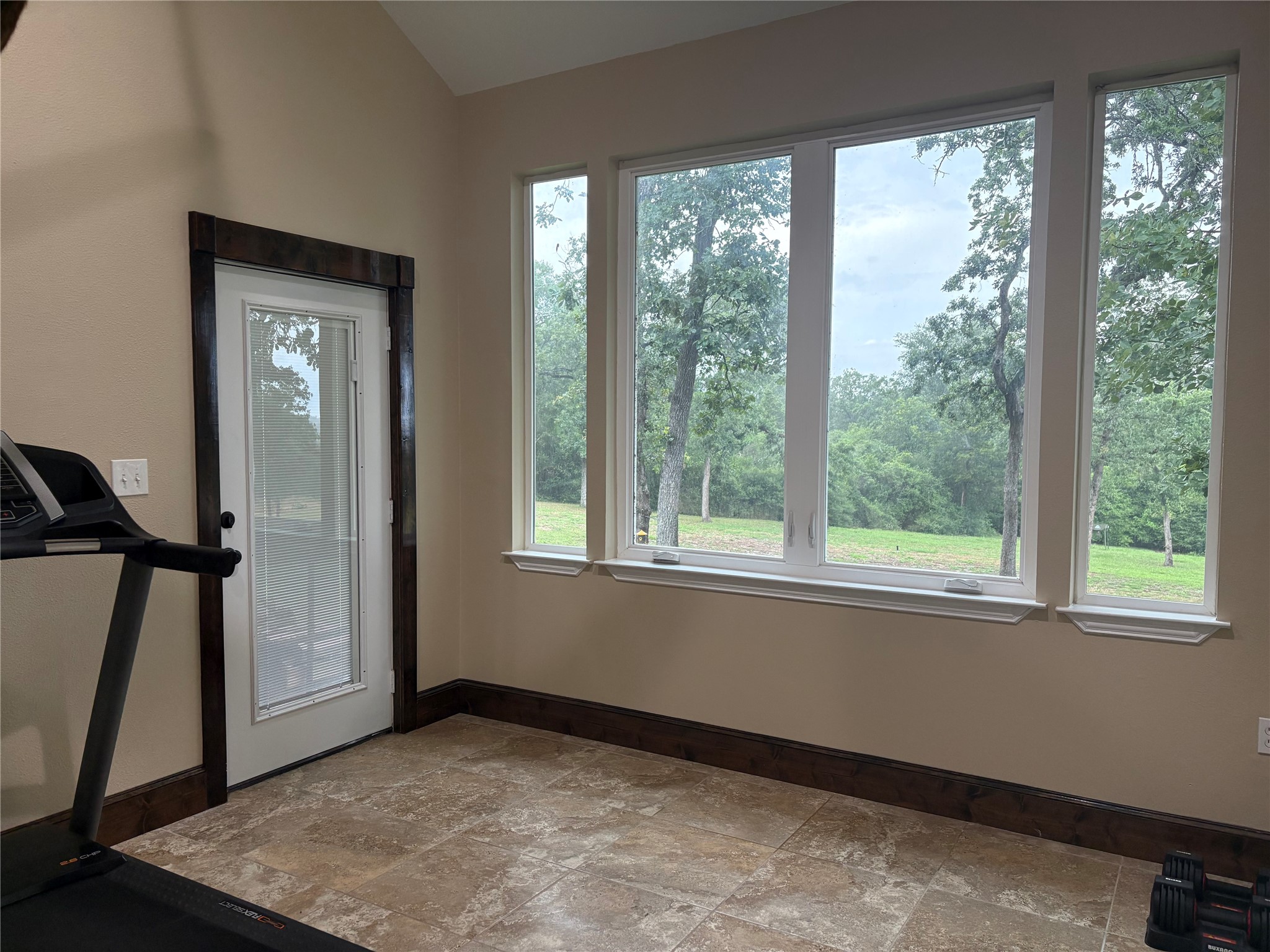 8595 Jared Road Bellville, TX 77418 - Photo 24 of 30 Full and spacious additional bedroom offers peaceful view, & large walk-in closet, that connects to adjacent bathroom with walk-in shower, and closet connected to adjacent spacious bathroom that connects to secondary suite.