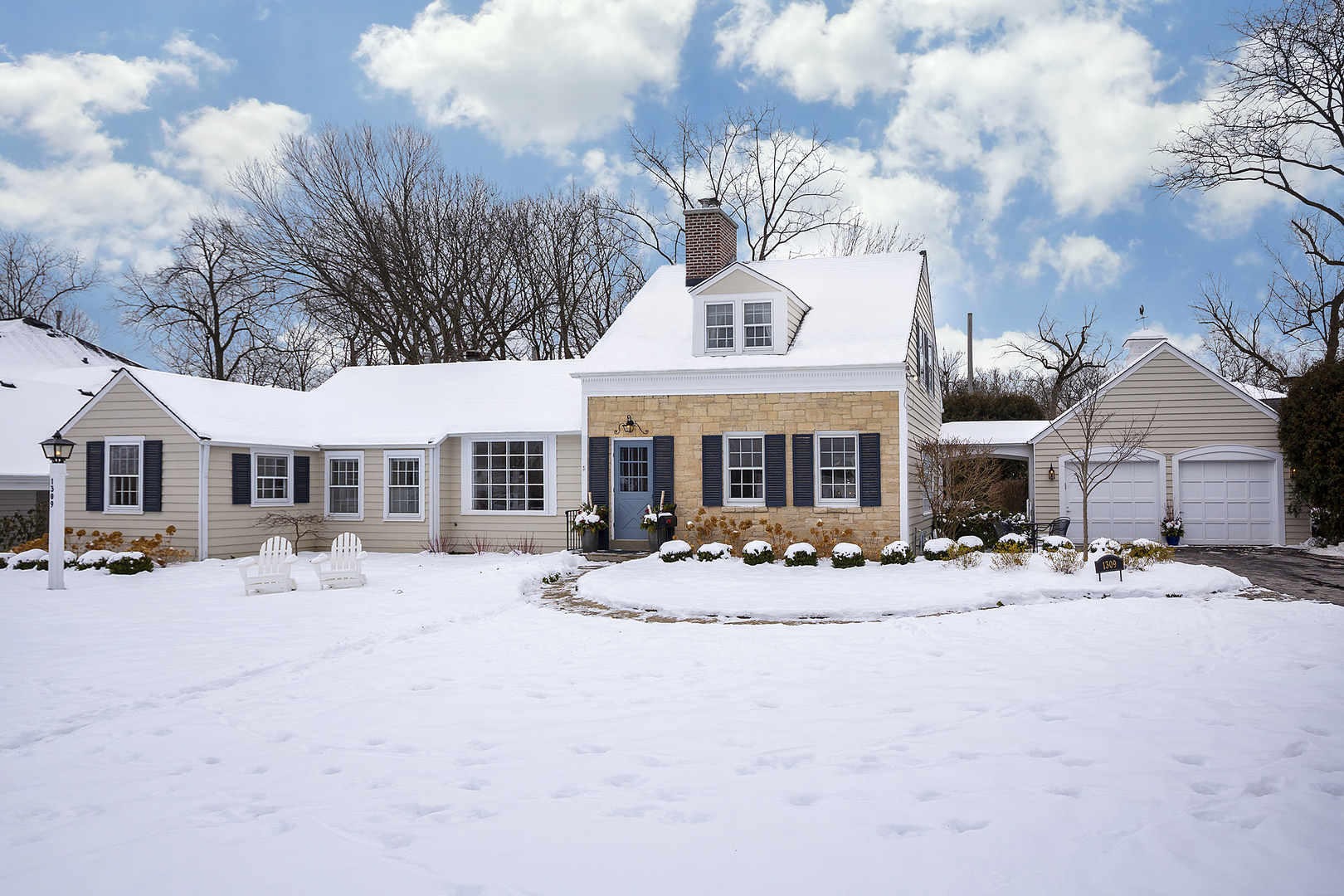 1309 Ridgewood Drive Northbrook, IL 60062 - Photo 1 of 18 a front view of a building with large trees and barbeque oven