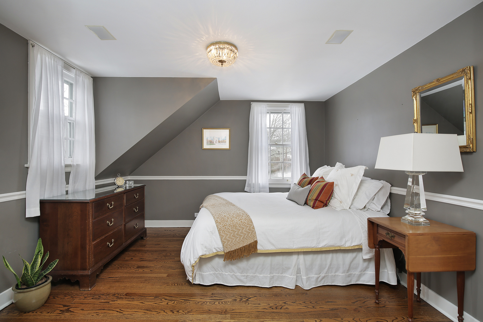 1309 Ridgewood Drive Northbrook, IL 60062 - Photo 11 of 18 a bedroom with a bed and wooden floor
