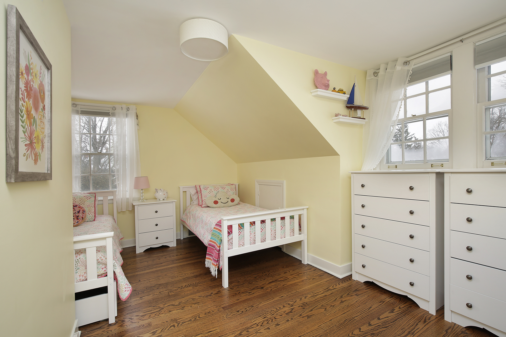 1309 Ridgewood Drive Northbrook, IL 60062 - Photo 12 of 18 a room with a baby bed a dresser and chair