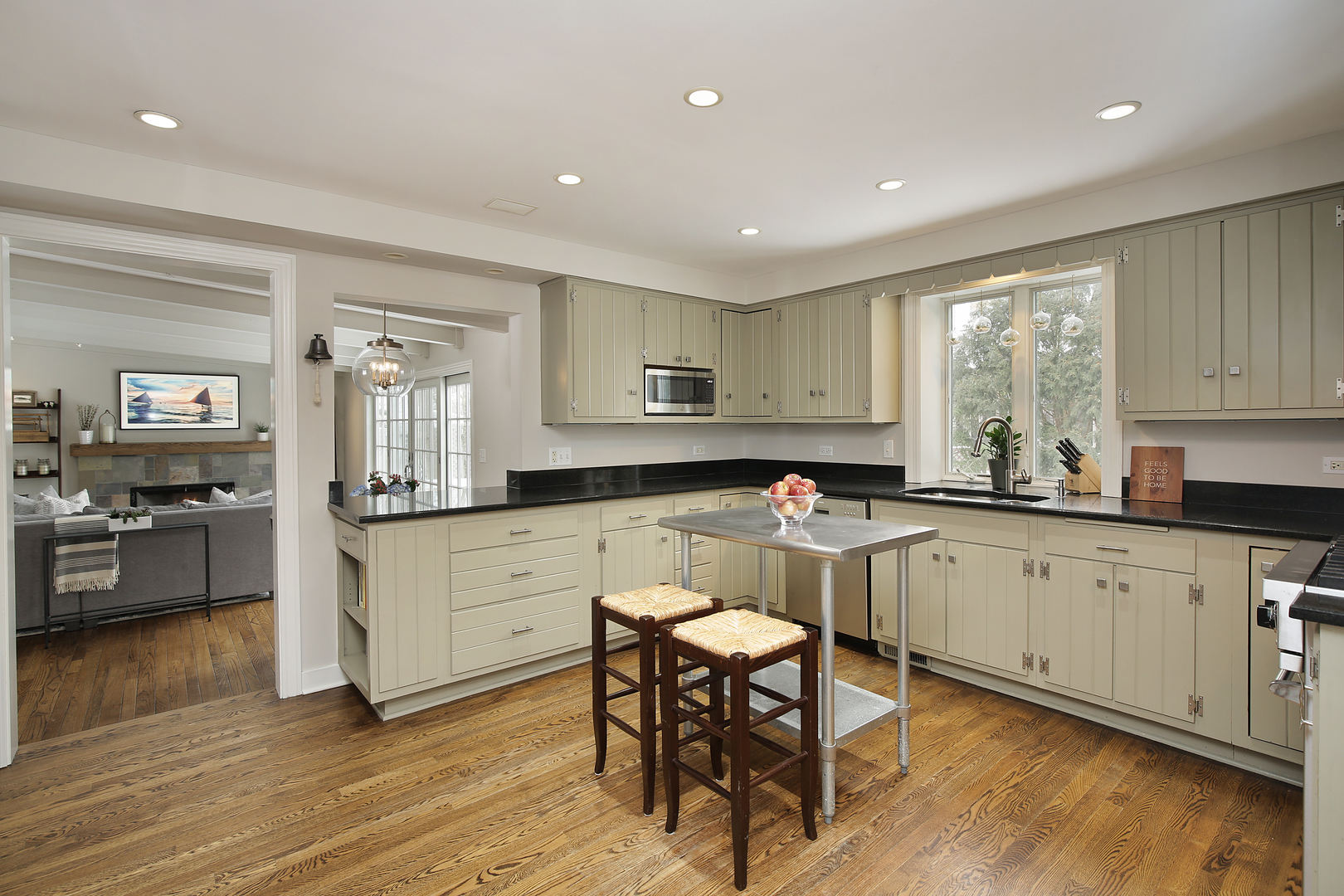 1309 Ridgewood Drive Northbrook, IL 60062 - Photo 6 of 18 a kitchen with a sink cabinets and wooden floor