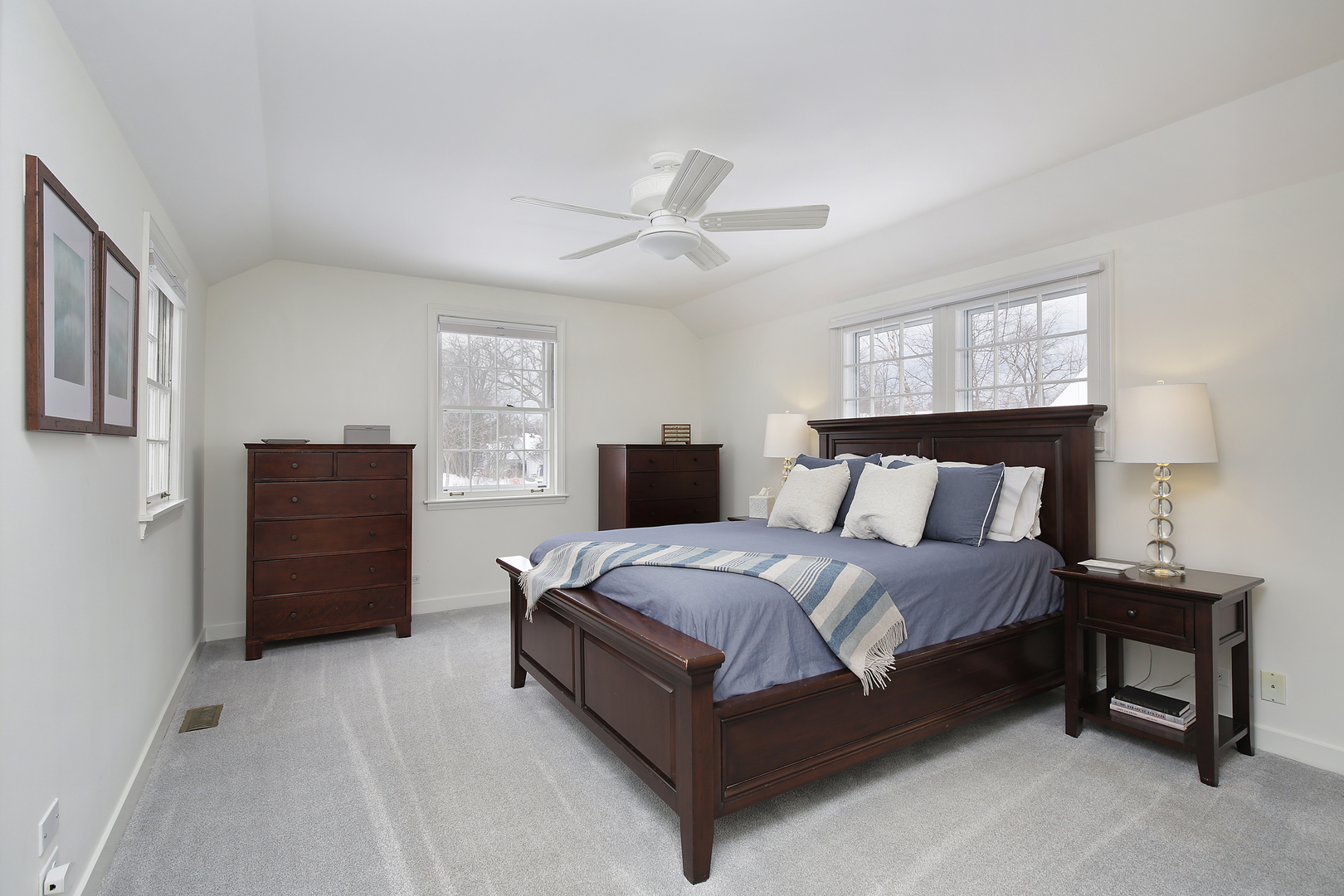 1309 Ridgewood Drive Northbrook, IL 60062 - Photo 8 of 18 a bedroom with a bed and a tv on a dresser
