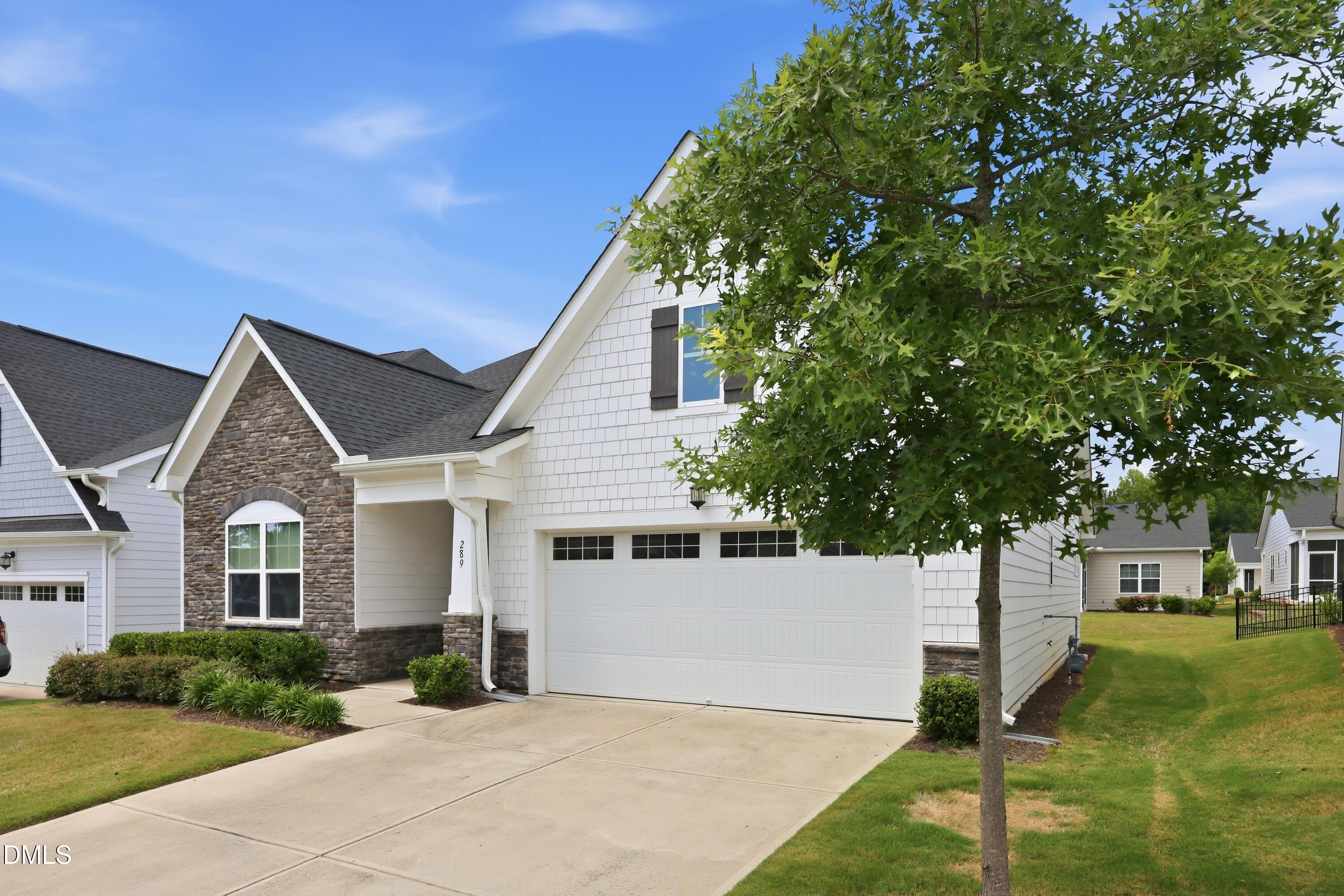 289 English Violet Lane Raleigh, NC 27610 - Photo 2 of 40 a front view of a house with a yard