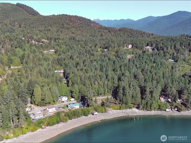 a view of a house with a mountain in the background