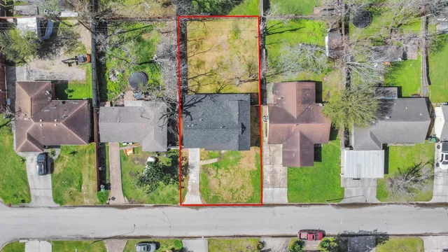 an aerial view of residential houses with outdoor space