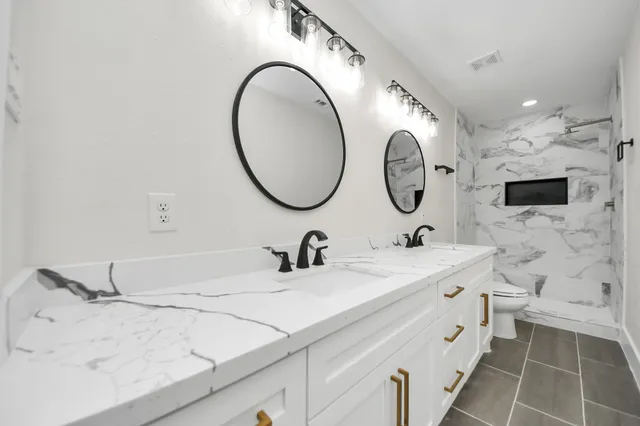 a bathroom with a sink and a shower curtain